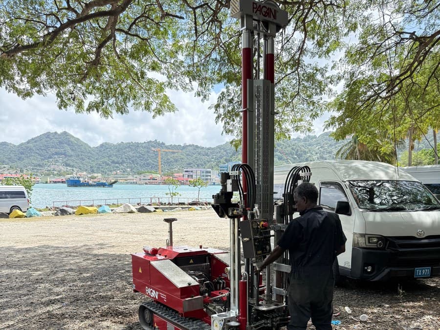 GID technician operating a Pagani CPT rig above Castries harbour on the reclaimed taxi-stand platform
